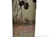 a glass vase with a picture of a tree on it