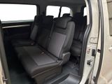 the interior of a car with the doors open and the seats down