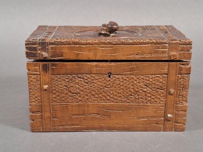 a small wooden box with a lid on a table