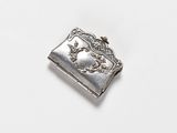 an image of a silver cigarette case with a horse on it