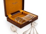 silverware in a wooden box with spoons and spoons in it