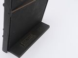 a black book that is sitting on top of a stand