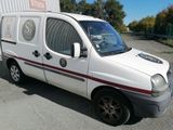a white van that is parked in a parking lot