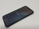 the back of an iphone with a black screen sitting on a table