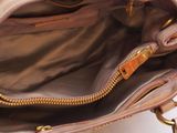 a close up of a purse with a zipper on it