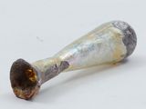 a small metal object that is sitting on a white surface