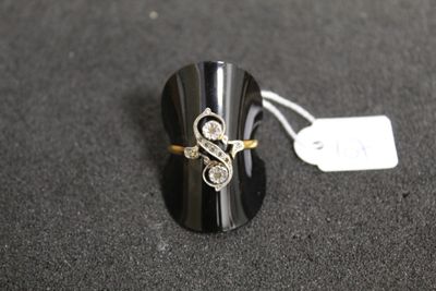 a close up of a ring on a black surface with a price tag