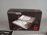 a box with a pen and a game on it