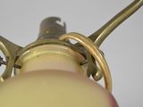 a close up of a person holding a light bulb