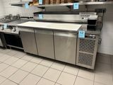 a kitchen with a lot of counter space in it