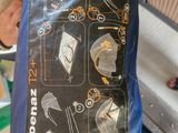 a blue bag that has a picture of different items on it