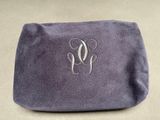 a close up of a purple bag with a monogram on it