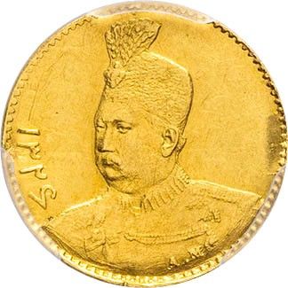 a gold coin with a crown on top of it