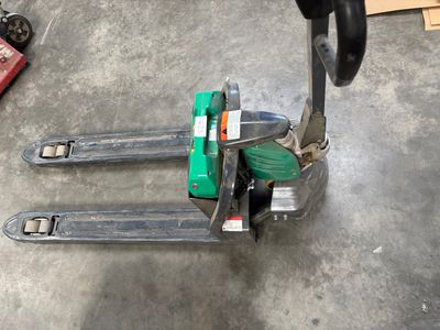 a fork lifter that is sitting on the floor