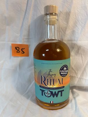 bottles of alcohol sitting on a white sheet with a price tag