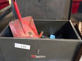 a black box with a red shovel inside of it