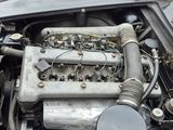 a close up of a car ' s engine with the hood open