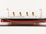 a model of a large ship on a wooden stand