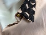 a close up of a shirt with a tie on it
