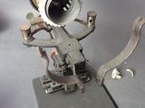 a metal object that has a camera on top of it