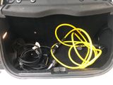 a trunk of a car with a bunch of wires in it