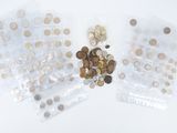 two bags of coins sitting next to each other on a table