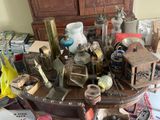 a table with a lot of antique items on it