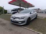 the car is parked in front of a gas station on the side of the road