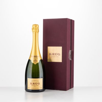 a bottle of champagne in front of a box