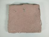 a small piece of clay with a ring on it