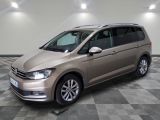 the volkswagen touran is parked in a large room with a checkered floor
