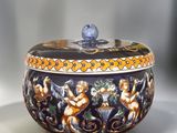 a bowl with a lid that has a design on it