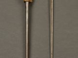 a close up of a knife and a knife holder on a table