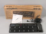 a box of electronic equipment on a table next to a keyboard