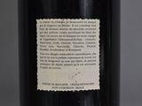 a label on a bottle of wine on a table