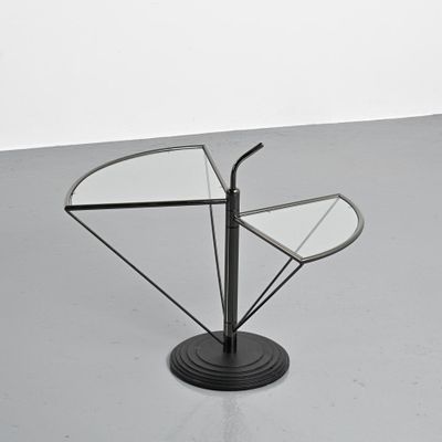 an image of a glass table with a metal base