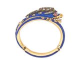 a close up of a gold ring with blue enamel and diamonds