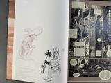 an open book with a drawing of a knight on it