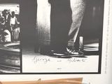 a poster of a man standing on a skateboard in front of a window