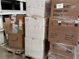 a stack of boxes sitting on a pallet in a warehouse