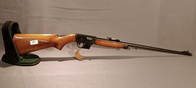 a rifle that is sitting on top of a table