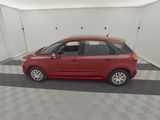 a picture of a red car parked in a garage