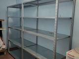 a room with a shelf and a chair in it
