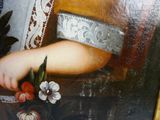 une photo d'un tableau représentant une femme tenant un couteau