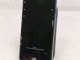 a cell phone that is sitting on top of a stand