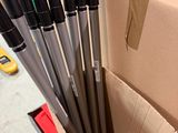 a cardboard box with a bunch of pens in it