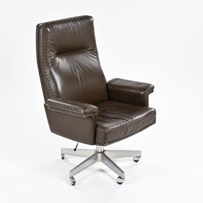 brown leather office chair with casteors and foot rest