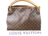 a louis vuitton handbag on a white background