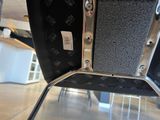 a close up view of a chair with a metal frame