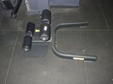 a gym equipment sitting on the floor next to a bag